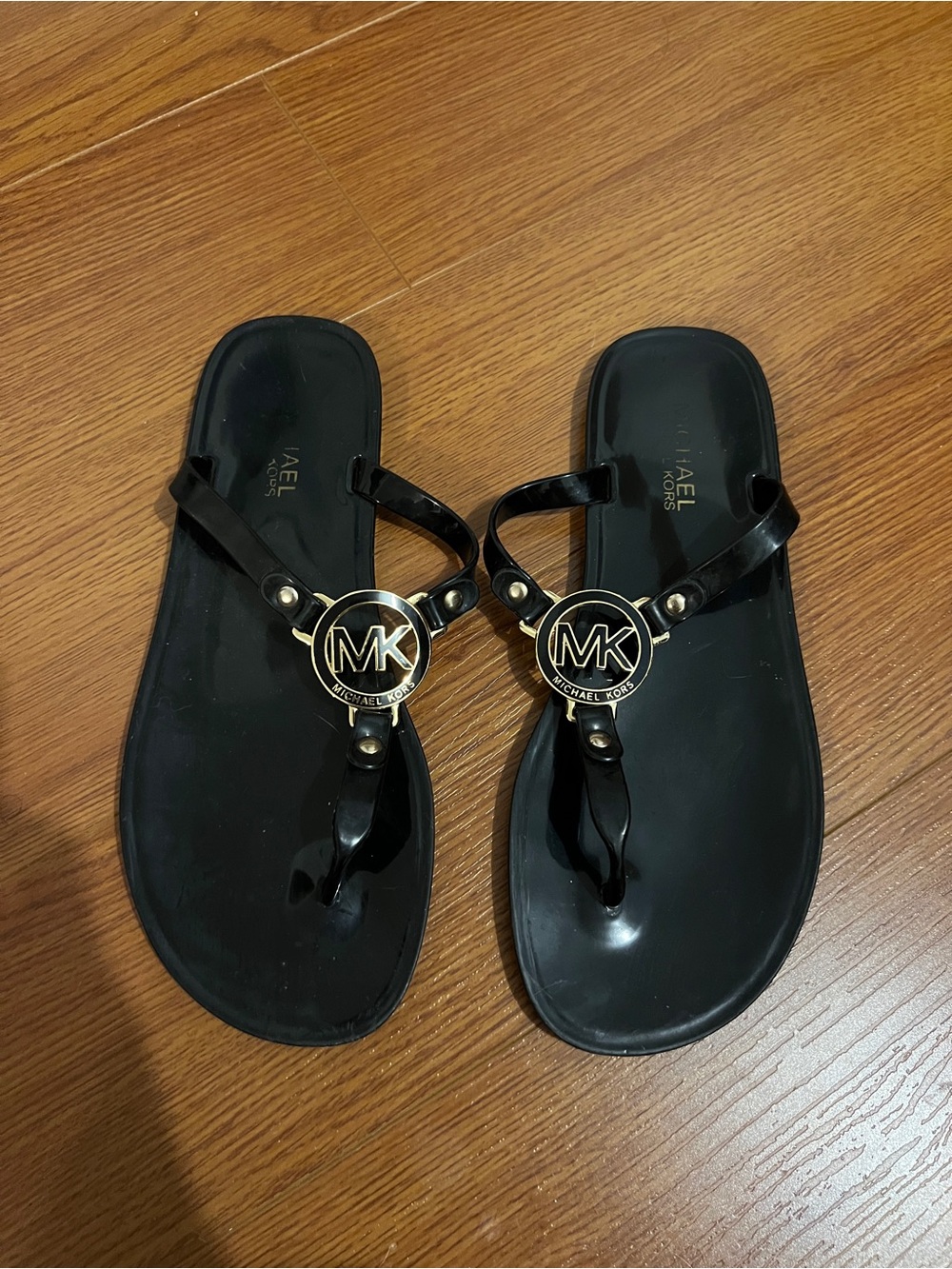 Michael Kors Black Jelly Logo Thong Sandals with Gold Accents
